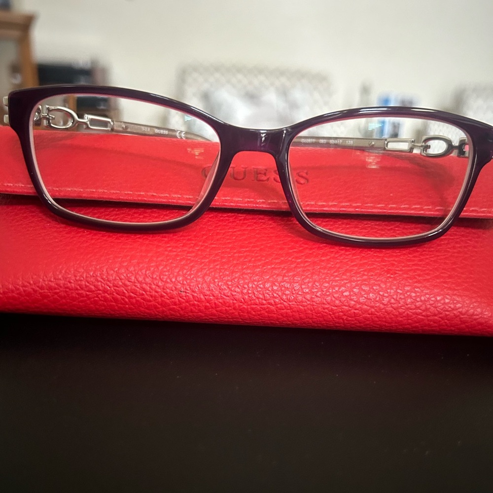 Women’s Guess Plum glasses (53-17-135) with case.